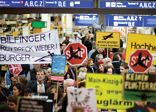 Protestors taking part in the so-called Montagsdemo (takes place every Monday)  anti-noise demonstration in Terminal 1 at Frankfurt International Airport.