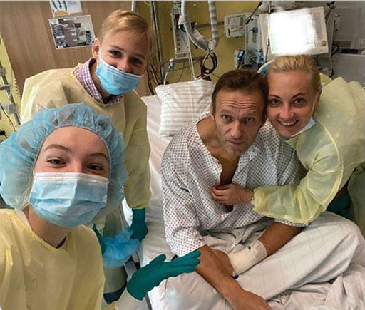 Russian opposition leader, Alexei Navalny, shown here with his family, recovering from an attempted assasination by poisoning while onboard a domestic S7 Airlines flight from the Siberian city of Tomsk to Moscow. Navalny recovered but (others have not been as lucky) and is currently being held on charges of corruption. Alexei Navalny Instagram image.