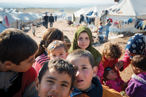 Internally displaced Syrians including children at a refugee camp near the Turkish border in Atmeh, Syria.